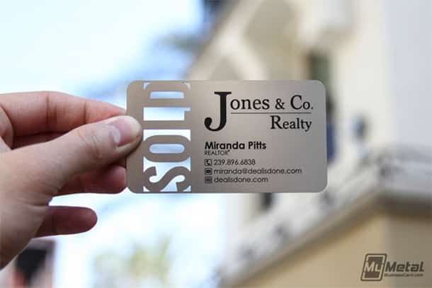 Real estate business card design with the cut out of the word Sold