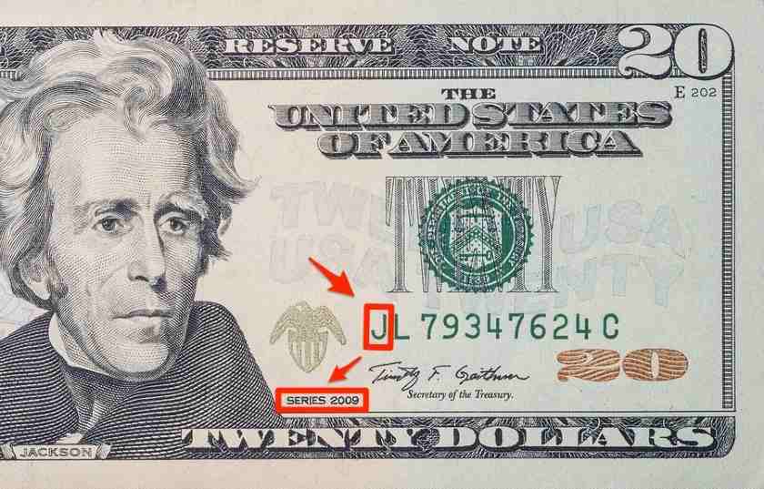 Showing a serial number and series year notated on $20 bill.
