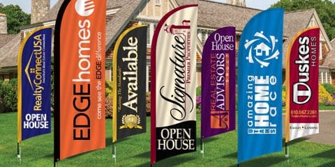 Range of colorful real estate flags.