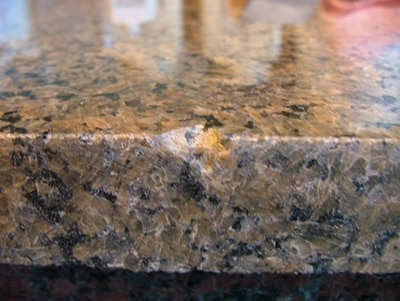 Chipped granite countertop.