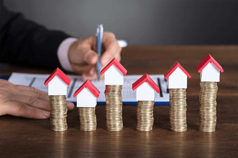 coin stacks and toy house