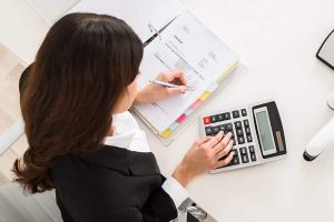 business woman using calculator