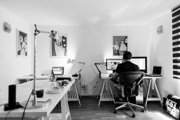 Man at computer in his home office. photo by tookapic on Pixabay