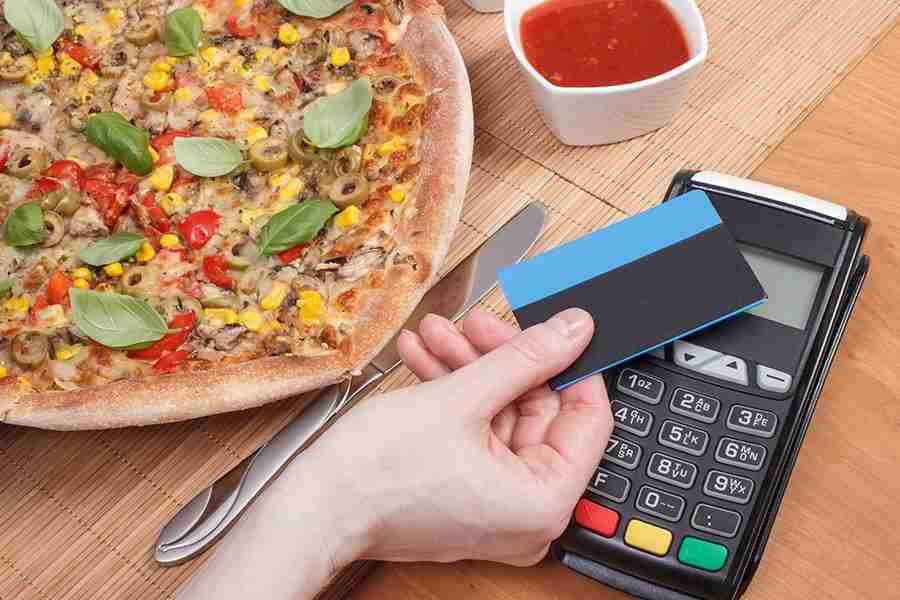 Credit card ready for swipe to pay a bill