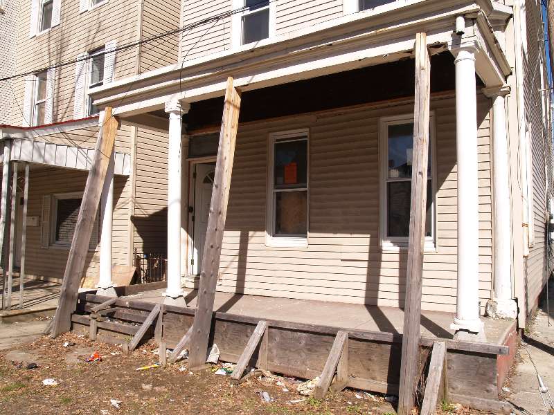 Repairing a damaged front porch.