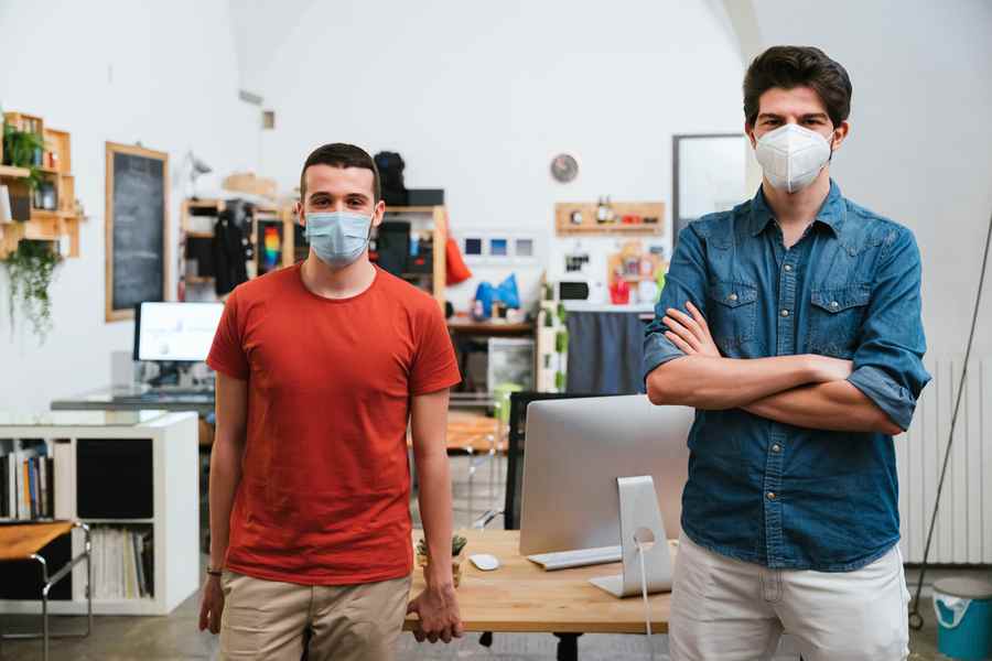 two men wearing facemask