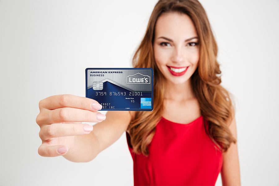 Attractive woman holding Lowe’s Business Rewards Card