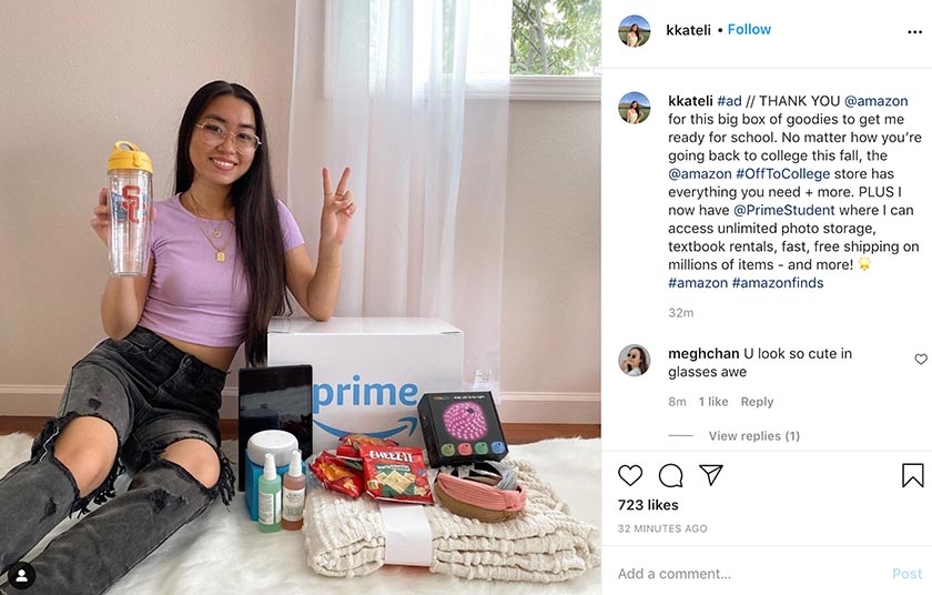 A girl taking a picture with sponsored goods