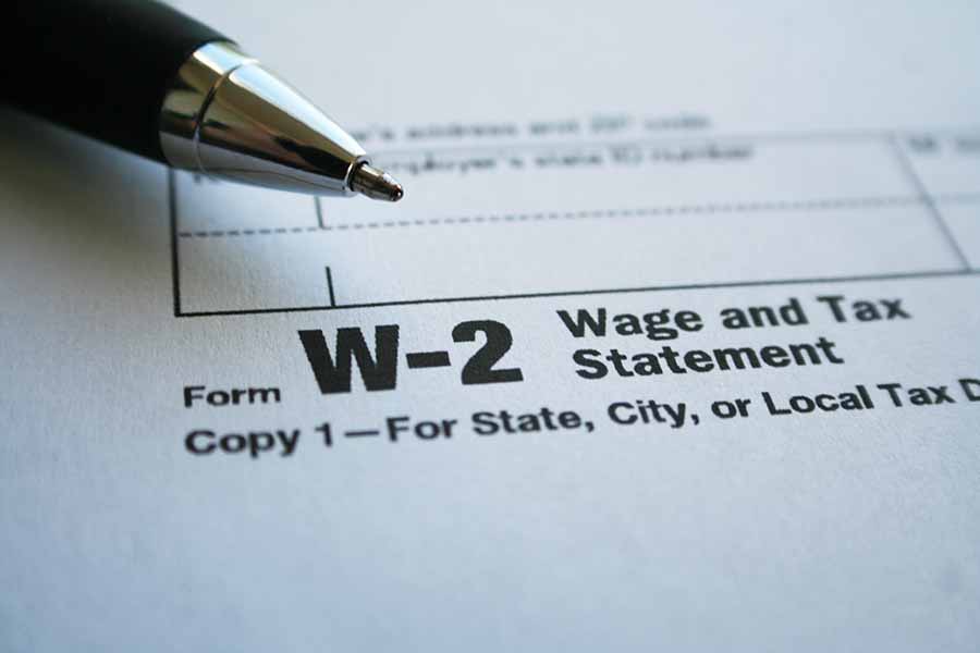 W-2 form with pen.