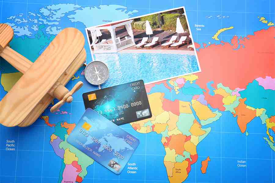 Credit cards on world map background.