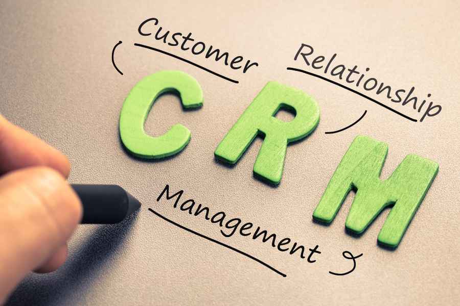 CRM abbreviation with hand writing definition.