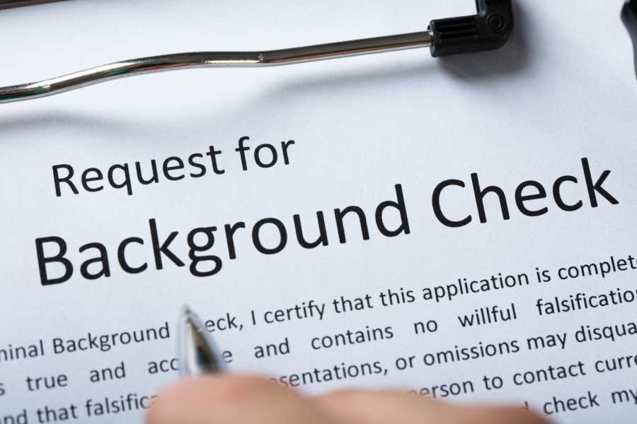 Showing a background check request paper.