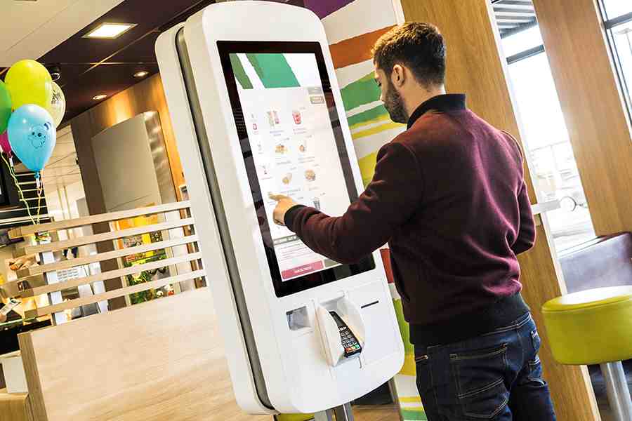 Man using a self-service kiosk