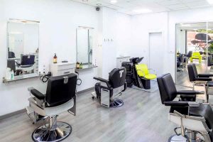 An empty and clean hair salon, and an arranged chairs.