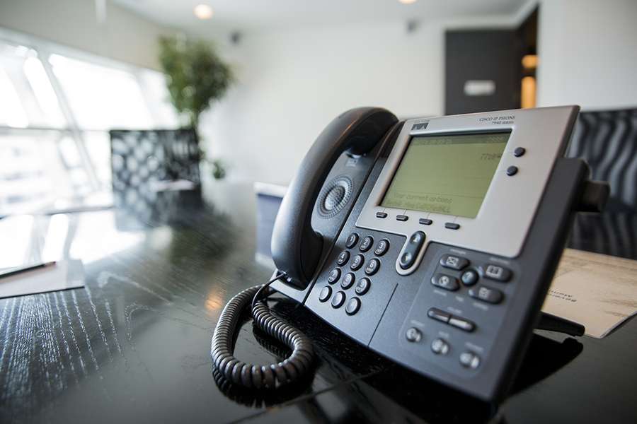 Close up shot of a business phone of an office.
