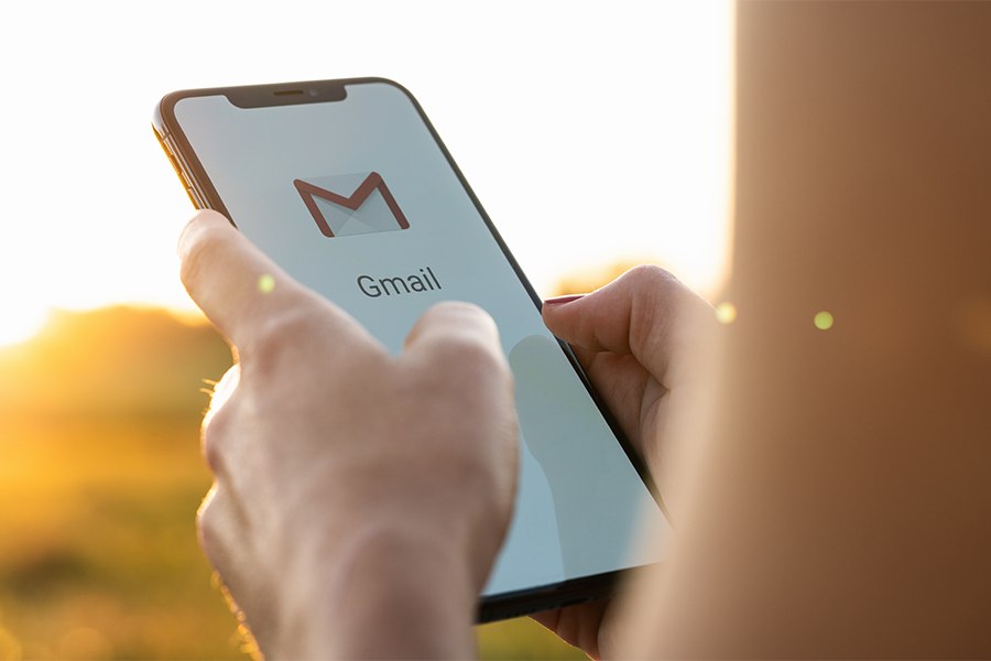 Opening Gmail on a mobile phone.