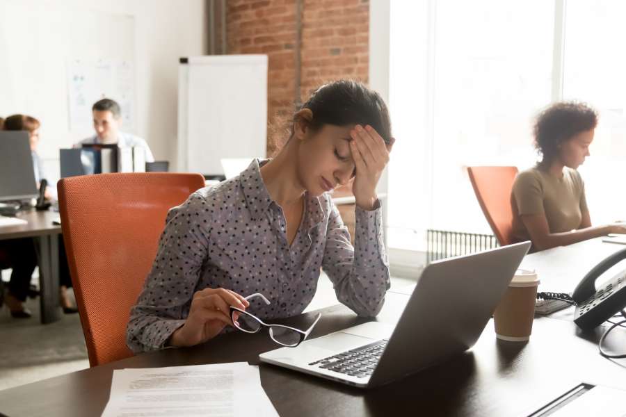 Working woman feel stressed, tired from work