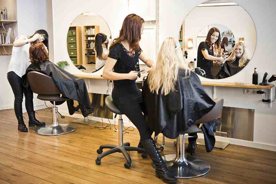 Salon female workers doing their jobs