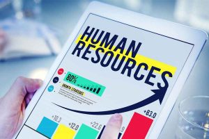 Man holding tablet with graph and human resources on it.