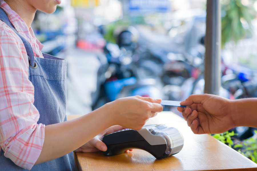Cusmtomer paying using credit card.