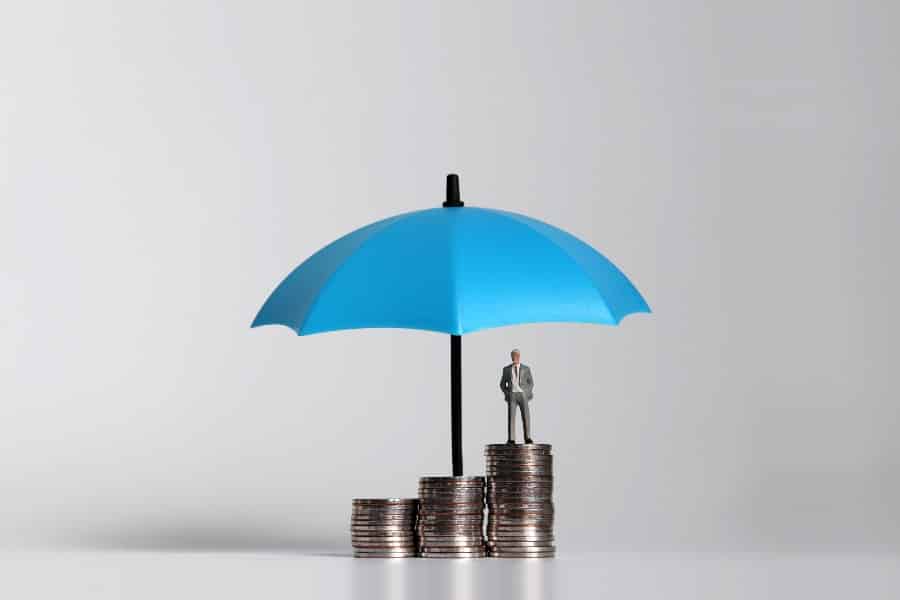 Coins under blue umbrella.