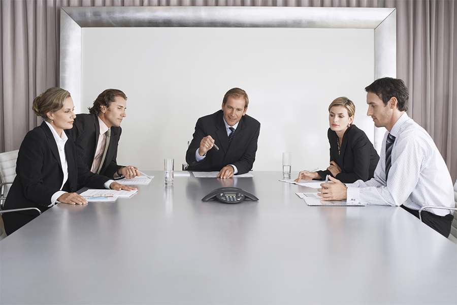A group of businesspeople having a conference meeting.