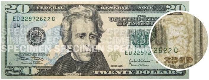 Showing a close-up of portrait watermark on a $20 bill.