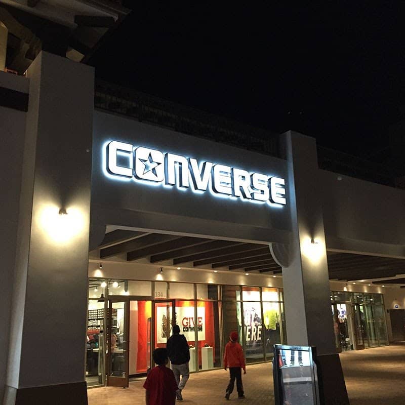Showing a Converse store sign.