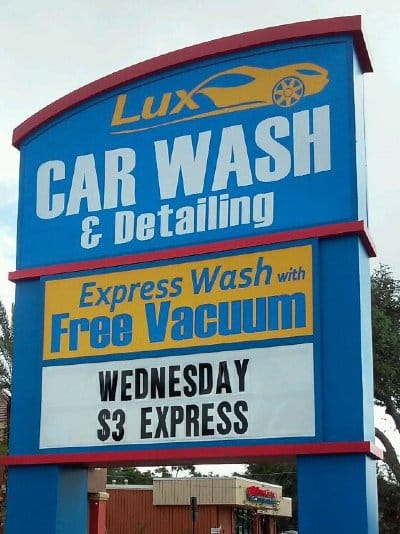 A Carwash uses a roadway sign.