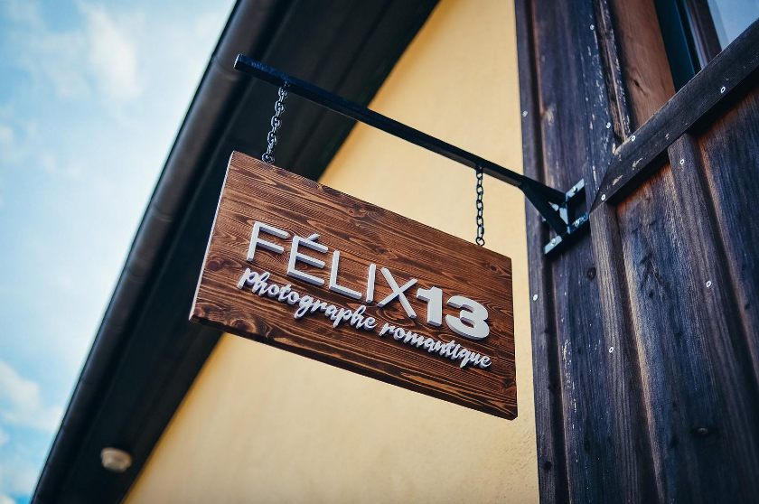 Showing a plywood sign of Felix 13.