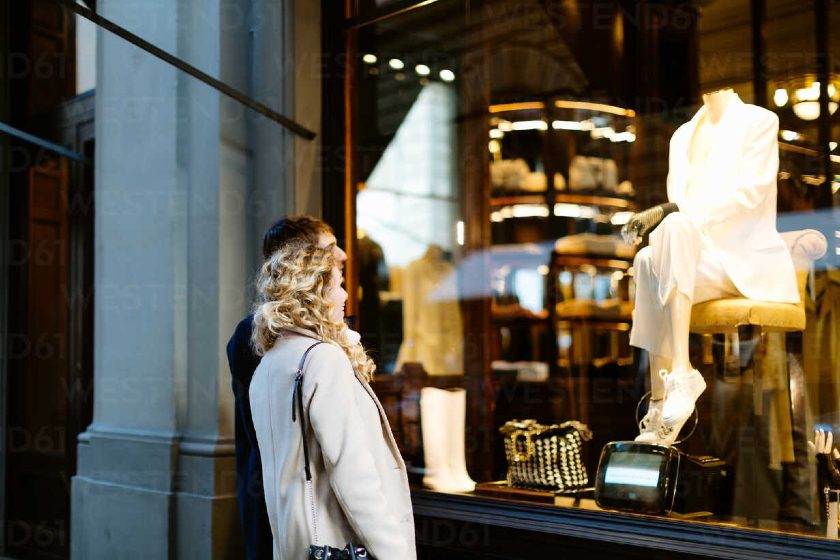 Showing a woman window shopping.