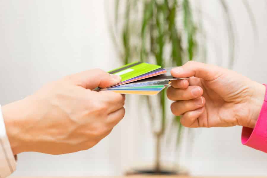 Rich Man Giving Woman Debit Card