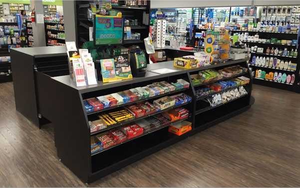 Countertop display with snacks and small toiletry items.