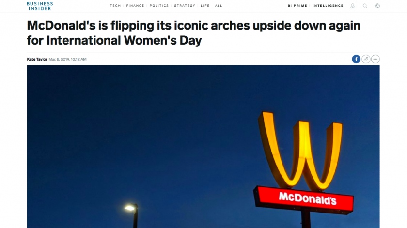 A McDonald's "M" signpost flipped upside down to read a "W."