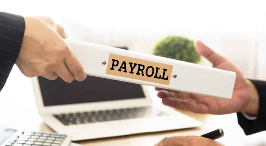 Employees holding payroll log.