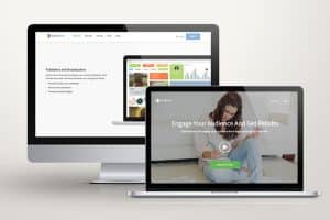 Showing loyalty program software on laptop and monitor screens.