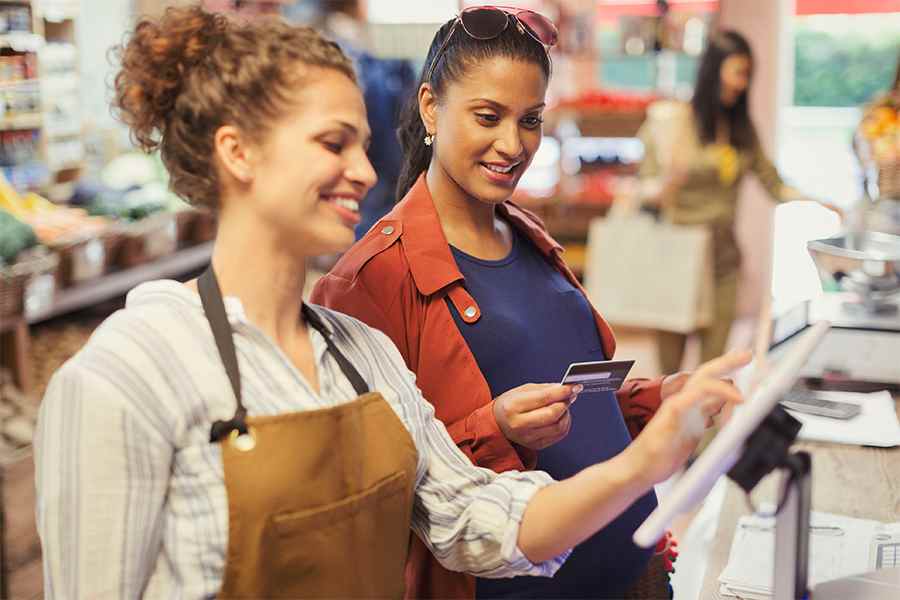 Cashier Staff and a Shopper Transacting