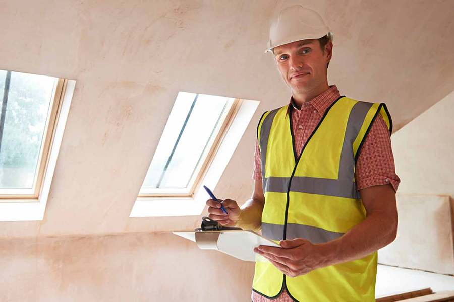 Building Inspector Checking A Property