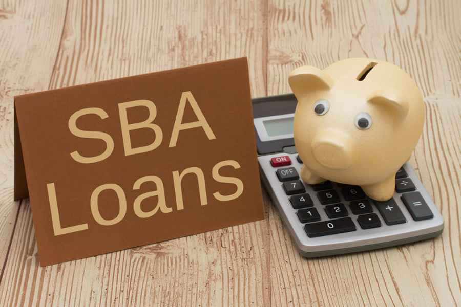 SBS Loans, piggy bank and calculator