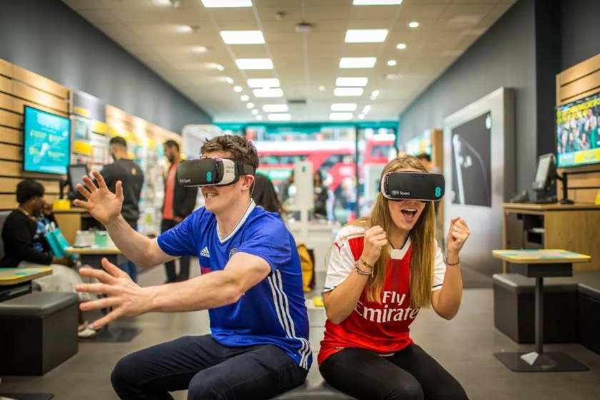 Showing shoppers use a vr headset.