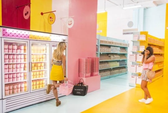 Showing a brightly lit and colorful freezer display.