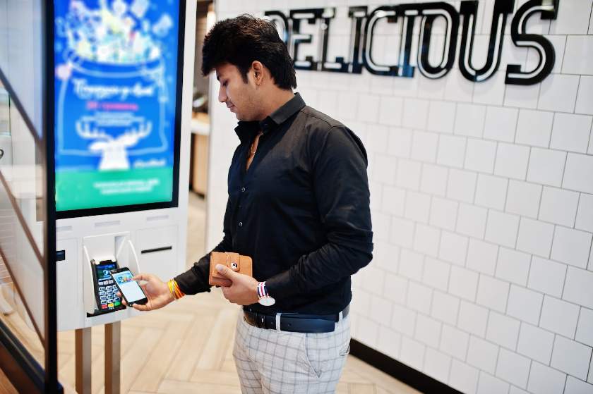 Screenshot of a Man Paying Using Smartphone