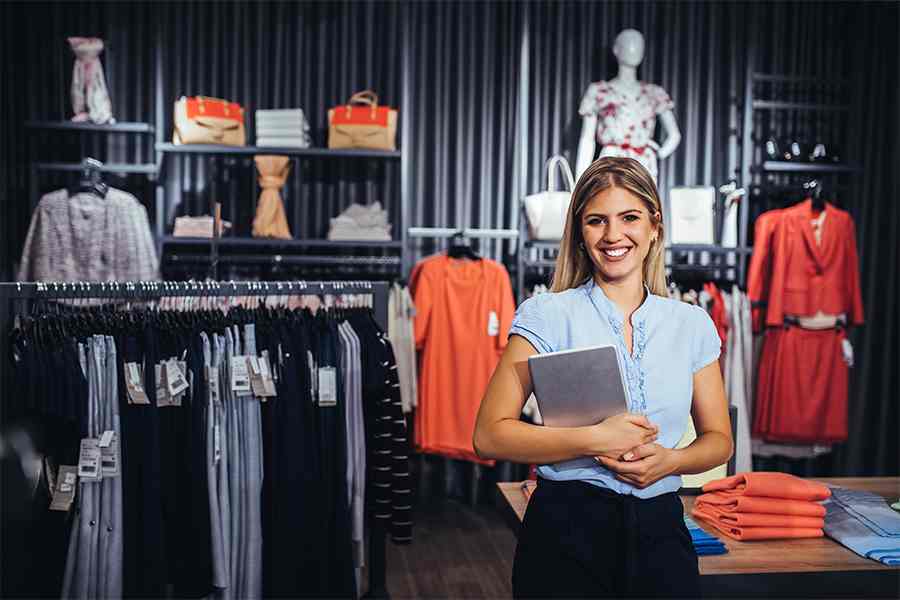 Woman taking a picture in a store.