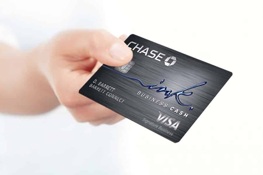 Hand holding a Chase Ink Credit Card.