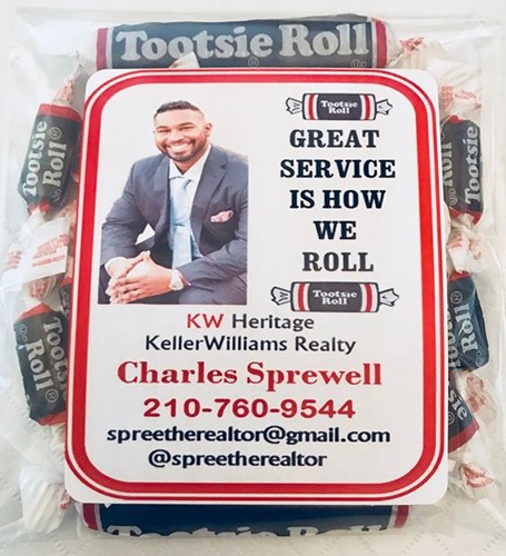 Bag of tootsie rolls with tag that says, "Great service is how we roll."