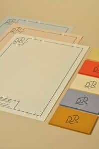 A letterhead design for a graphic designer that uses the geometric logo's elements as the border.