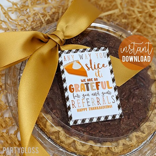 Packaged pie with bow and tag that says "Any way you slides it, we are so grateful for you and your referrals. Happy Thanksgiving!"