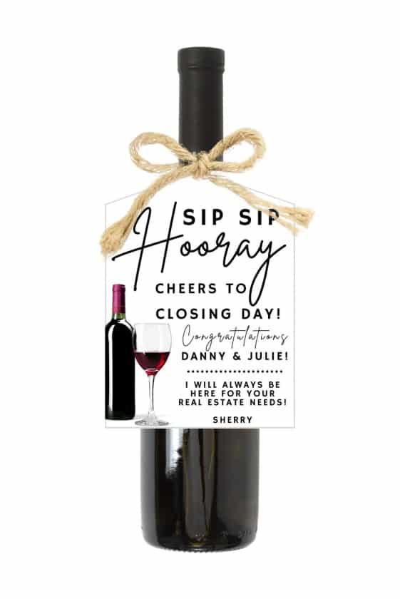 Wine bottle with gift tag that says "Sip sip hooray! Cheers to closing day."