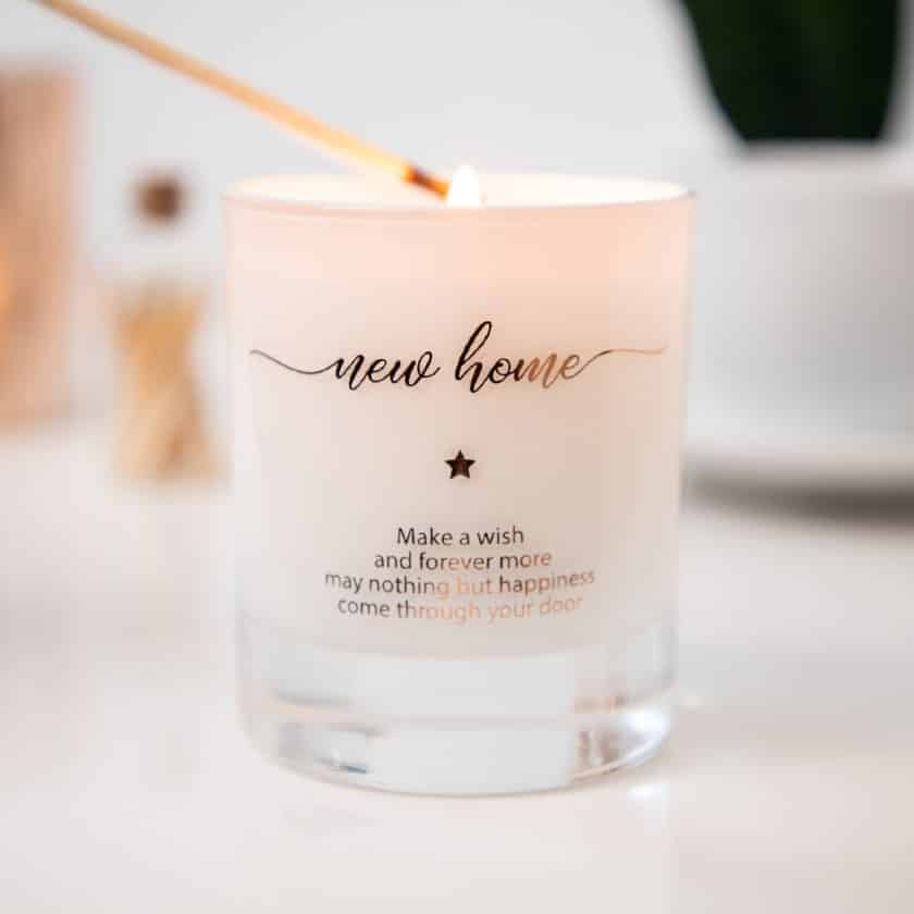Candle with customized engraving that says "make a wish and forever more may nothing but happiness come through your door"