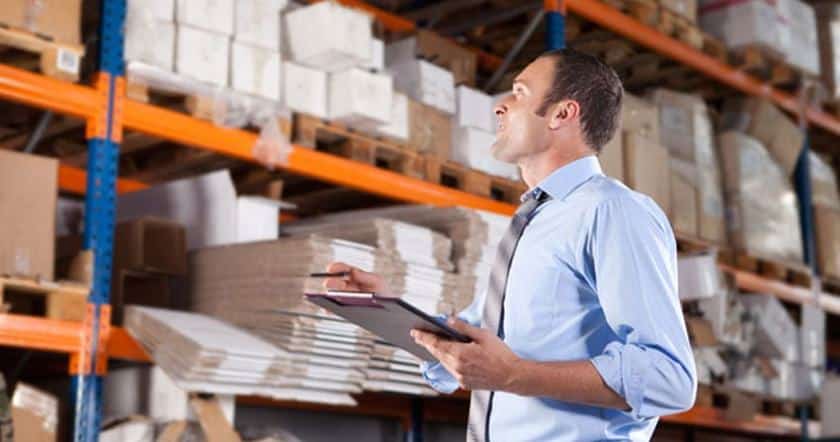 Showing an employee working on inventory.